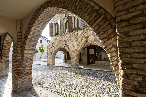Portobuffolè, Italy. November 9, 2023.  the arches of the porticoes of the streets in the center of the town