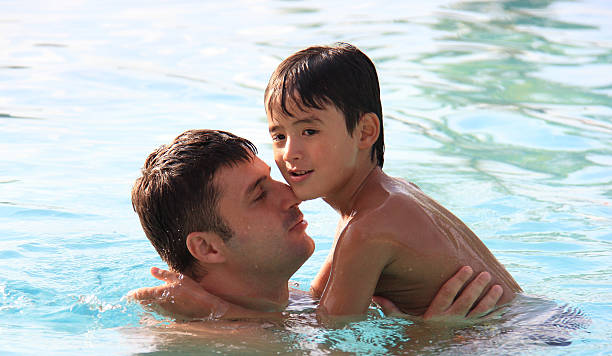 istock father and son bonding in the sea 178781053