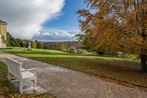 Rain cloud passing as the autumn sun starts to shine at Polesden Lacey in Surrey