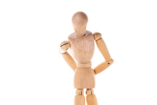 istock A wooden mannequin stands confidently with his hands on his hips. This versatile image can be used to represent assertiveness, confidence, fashion, design, or creativity. 1787814171