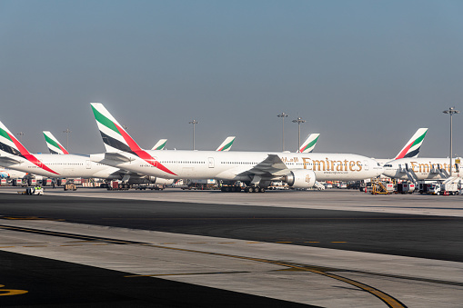 Dubai, United Arab Emirates - October 12, 2023: Emirates planes in the Dubai International Airport