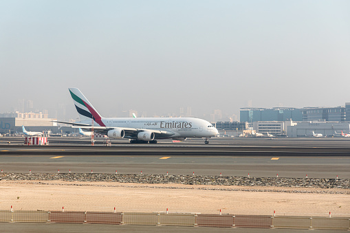 Dubai, United Arab Emirates - October 12, 2023: Emirates planes in the Dubai International Airport