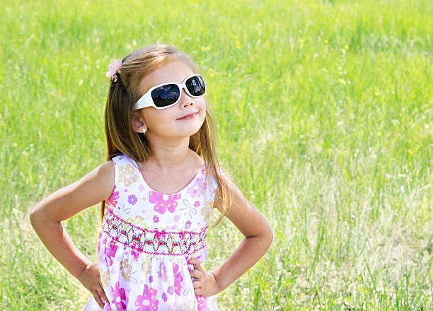 istock Cute smiling little girl on the meadow 178782330