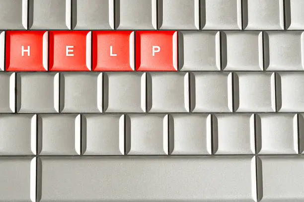 Photo of Help spelled on a keyboard