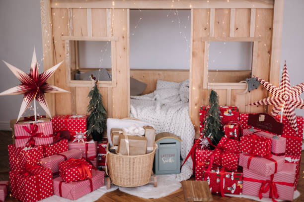 istock Children room with Christmas decorations. Presents in red festive packaging. Interior design for kids 1787824219