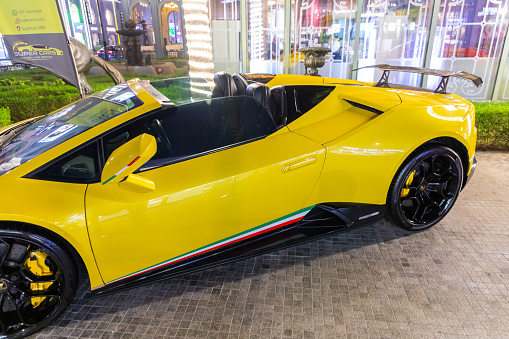 Dubai, United Arab Emirates - June 21, 2023: Yellow Lamborghini Huracán Rental car in Dubai