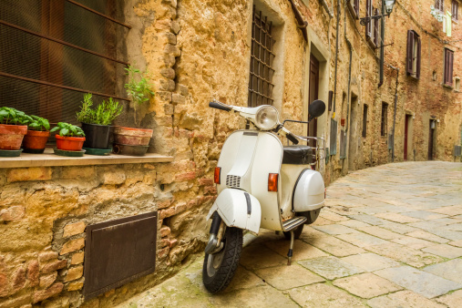 Old scooter on the street in Italy