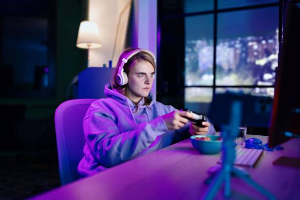 istock Woman playing a video game with a joystick 1787831009