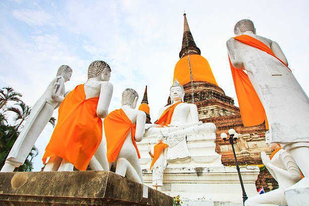 istock Ancient pagoda and white buddha statue 178783879