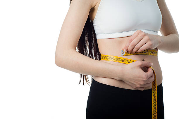 istock Brunette girl measuring her body 178783893