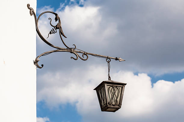 istock Old lamppost against the sky with clouds. 178784608