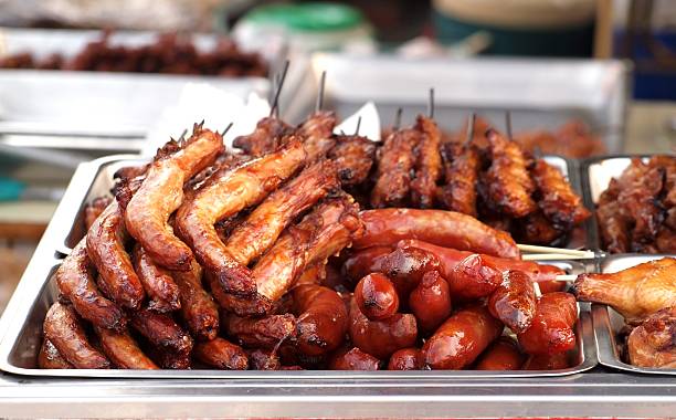 Barbecued Sausages and Chicken stock photo