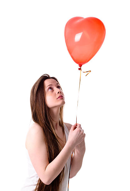 istock Woman with heart in hand sad 178785716