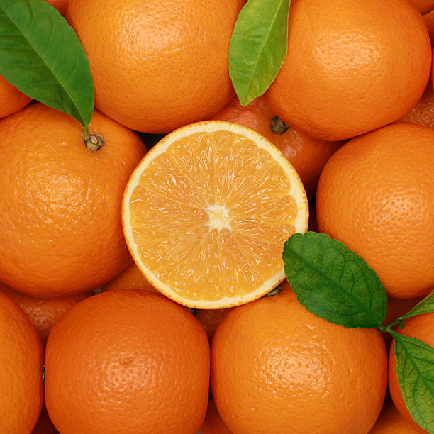 istock Group of oranges with leaves 178785823