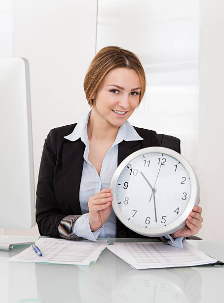 istock Businesswoman Holding Clock 178785953