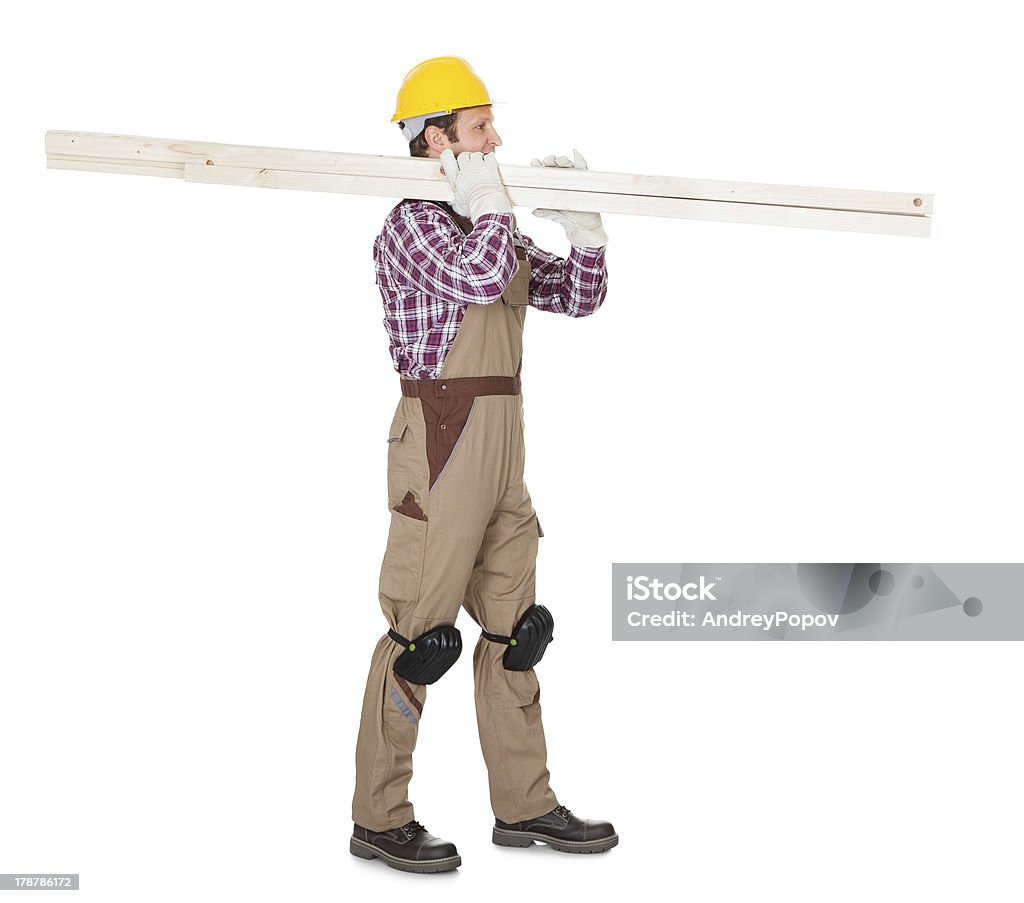 Carpintero con tablas de madera - Foto de stock de Accesorio de cabeza libre de derechos