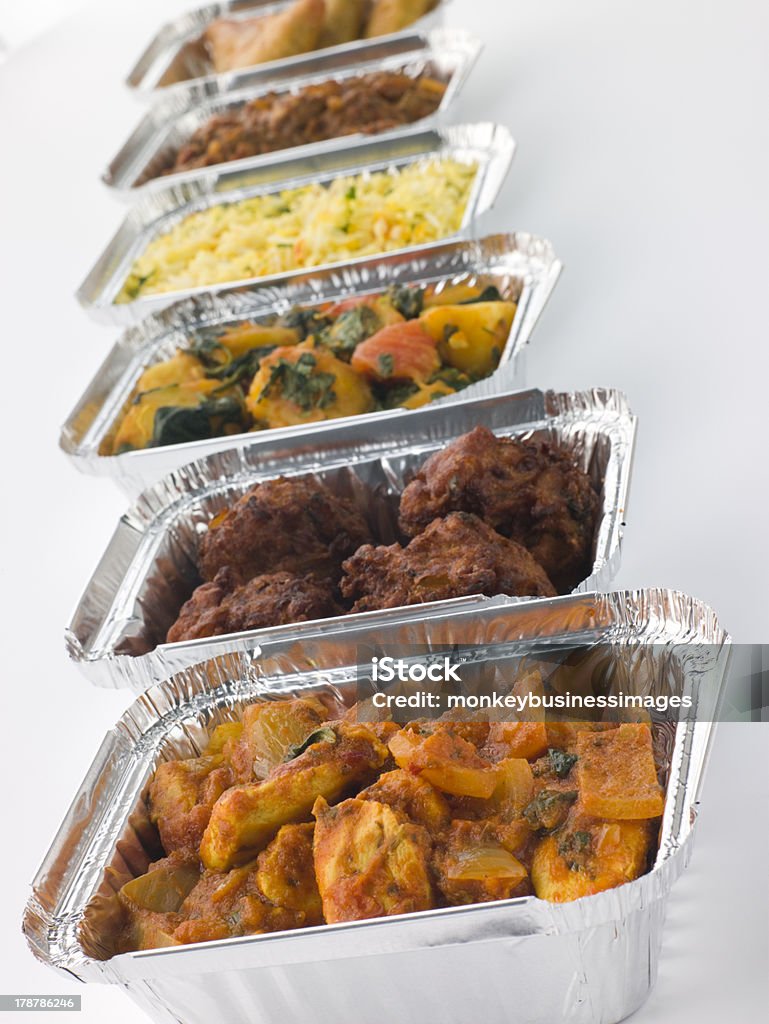 Selection Of Indian Take Away Dishes In Foil Containers Selection Of Indian Take Away Dishes In Foil Containers In A Row Take Out Food Stock Photo