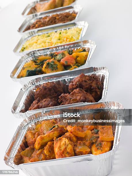 Selection Of Indian Take Away Dishes In Foil Containers Stock Photo - Download Image Now