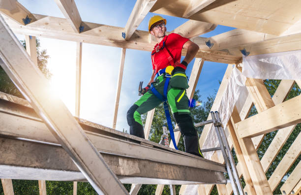 istock Construction Site Worker Building Wooden House Roof Framing. 1787868275