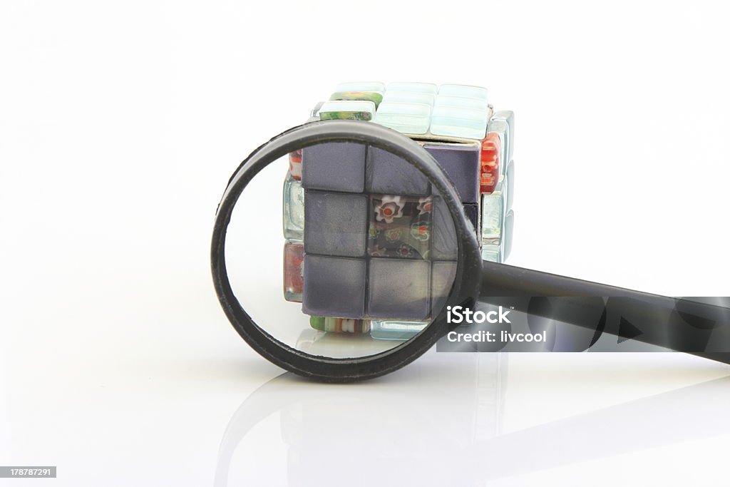 Cube and magnifying glass Art Stock Photo