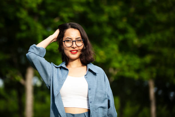 Portrait of beautiful young woman in nature.