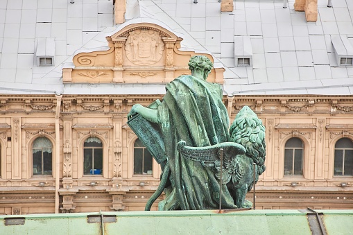 Saint PETERSBURG, RUSSIA - May 27, 2021: Sculptures on the roof of St. Isaac's Cathedral, museum. Christian history. Monument of culture and architecture.