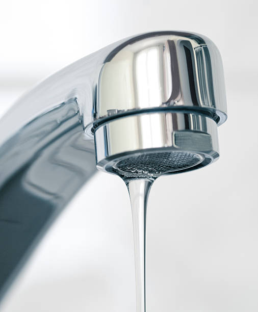 istock Water flowing from faucet, close up 178788625