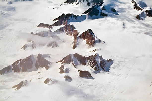Aerial view of the antarctica with glaciers, mountain, snow and river