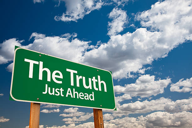 istock The Truth Green Road Sign 178789169