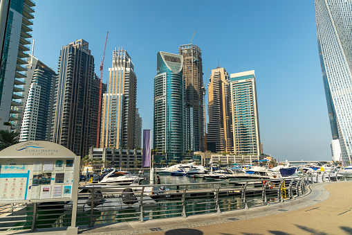 Dubai, United Arab Emirates - October 12, 2023: Yachts and Boats station in Dubai Marina canal