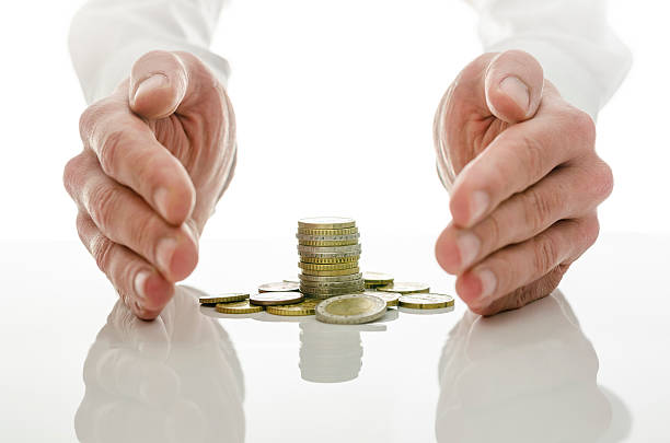 Male hands around Euro coins Male hands around Euro coins. Concept of solution to financial crisis. debt recovery stock pictures, royalty-free photos & images
