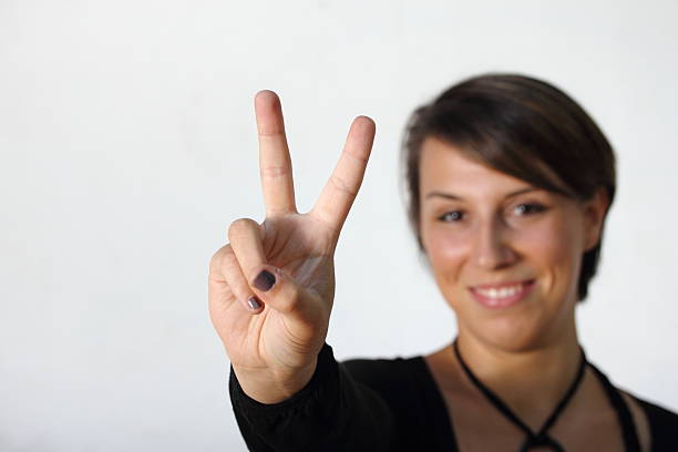 istock girl making peace sign 178790745