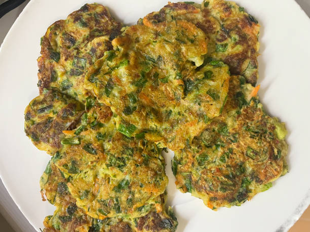 istock A hash brown made of fresh zucchini fried in a pan. 1787923688