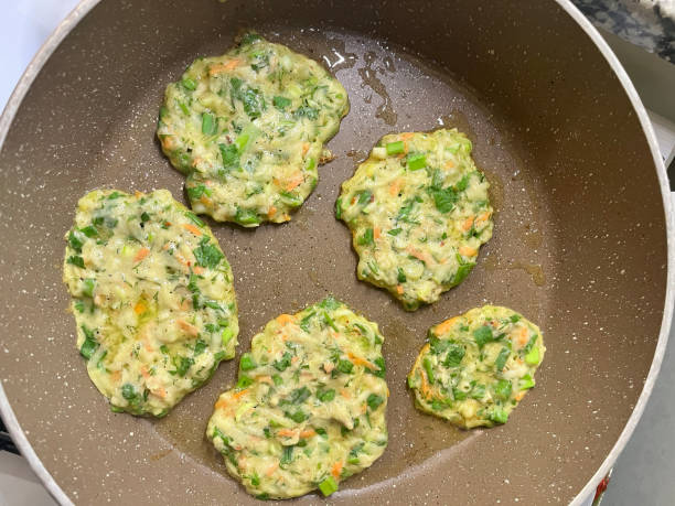 istock A hash brown made from fresh zucchini fried in a pan. 1787923690