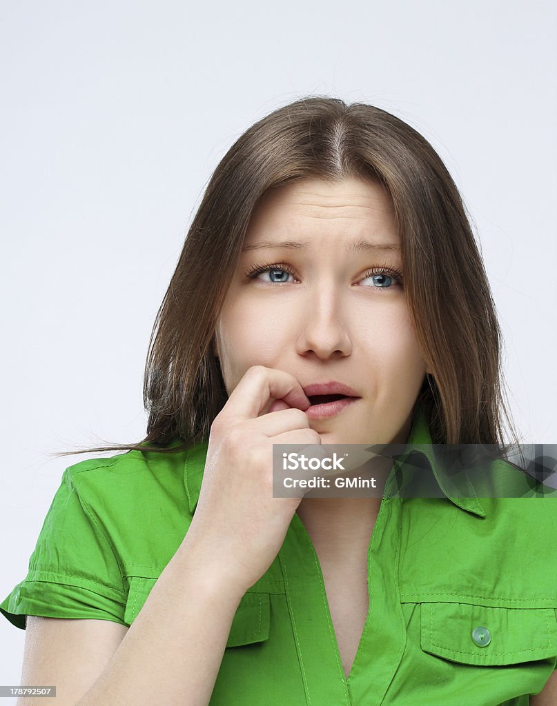 Retrato de la Mujer ha decepcionado morderse las uñas. - Foto de stock de 20-24 años libre de derechos