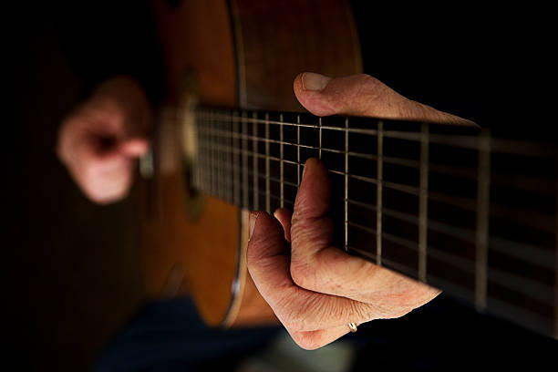 Playing guitar stock photo