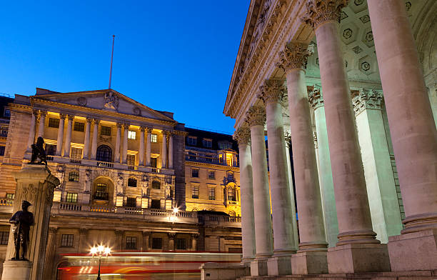 Bank of England London at dusk The Bank of England and Royal Exchange Building in the City of London at dusk, England bank of england stock pictures, royalty-free photos & images