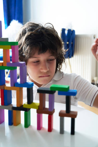 istock Cute Little Boy Playing with wooden block 1787933763
