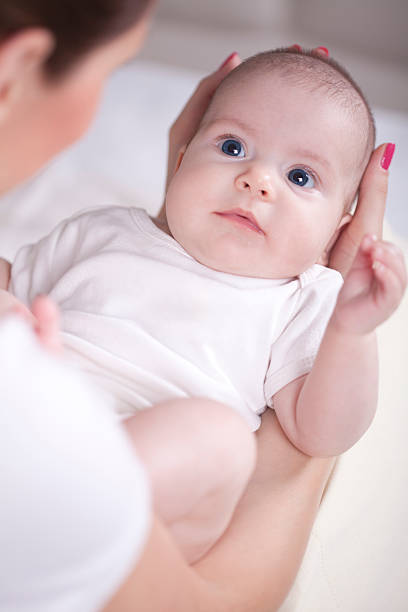 istock Three monts old baby in mother's hands 178793424