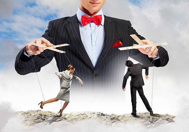 Businessman puppeteer Image of young businessman puppeteer. Leadership concept puppet master stock pictures, royalty-free photos & images