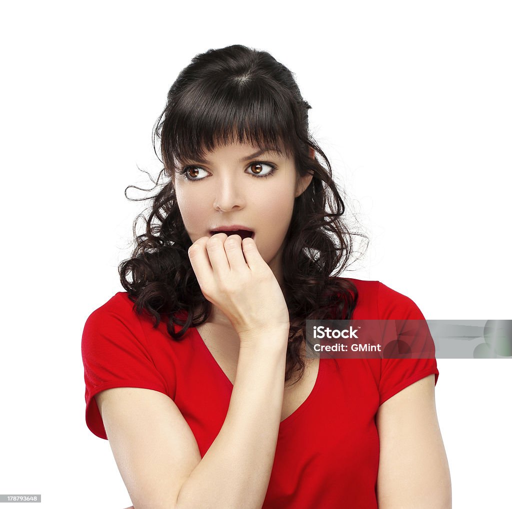 Retrato de la mujer nervioso morderse las uñas. Fondo blanco. - Foto de stock de 20-24 años libre de derechos