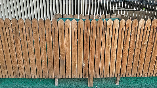 Wooden fence in front of the building.