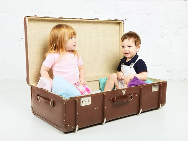istock Boy and Girl in Suitcase 178794154