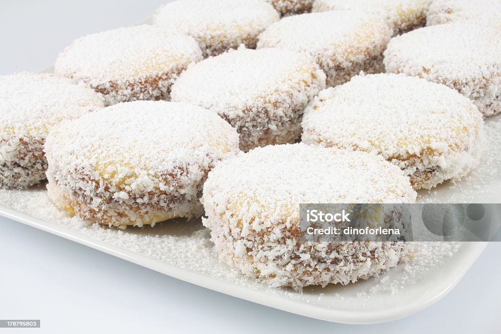 Cookies with dulce de leche and coconut Cookie with caramelized milk dulce de leche and coconut, Argentine Cookies Alfajores Coconut Stock Photo