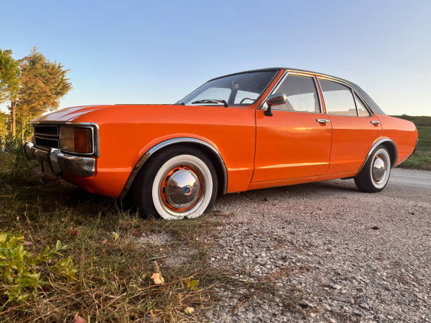 istock Orange classic car with a flat tire. 1787958981