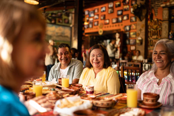 istock Happy senior friends talking at restaurant 1787965183