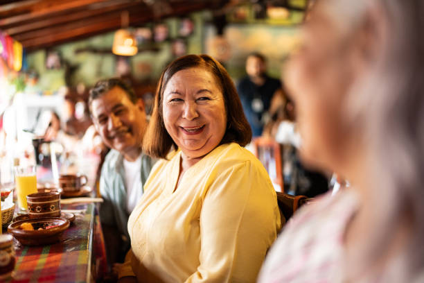 istock Mature woman talking with her friend at restaurant 1787965185