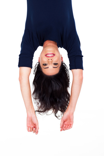 pretty young woman upside down portrait on white