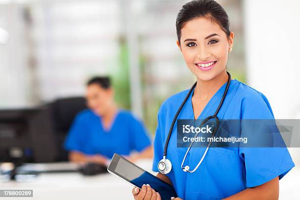 Female Nurse In Blue Uniform With Tablet Stock Photo - Download Image Now - Nurse, Receptionist, Stethoscope