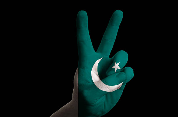 istock pakistan national flag two finger up gesture for victory 178800980